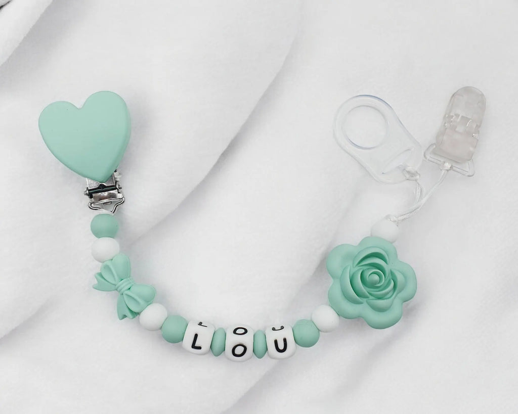 Attache tétine fleur silicone