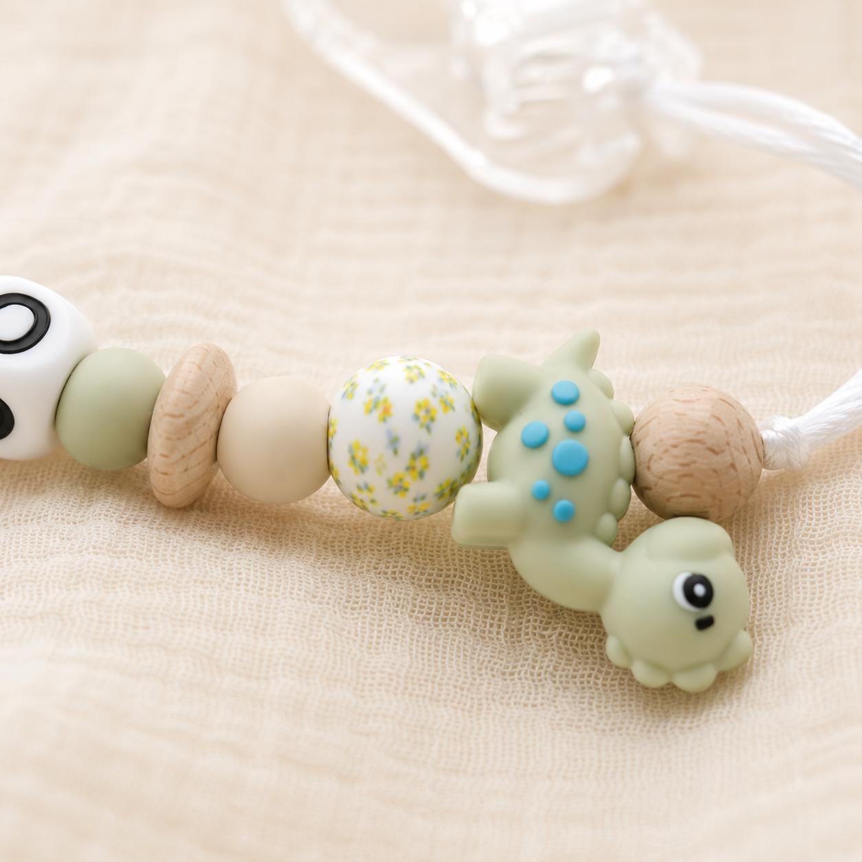 Attache sucette personnalisée dinosaure – silicone et bois – vue 4