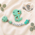 Attache sucette personnalisée dinosaure gris ou vert – silicone – photo principale